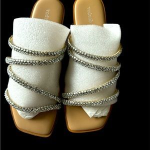 Stylish sandal soft and  comfy insole . Take the heels off and slide these on.